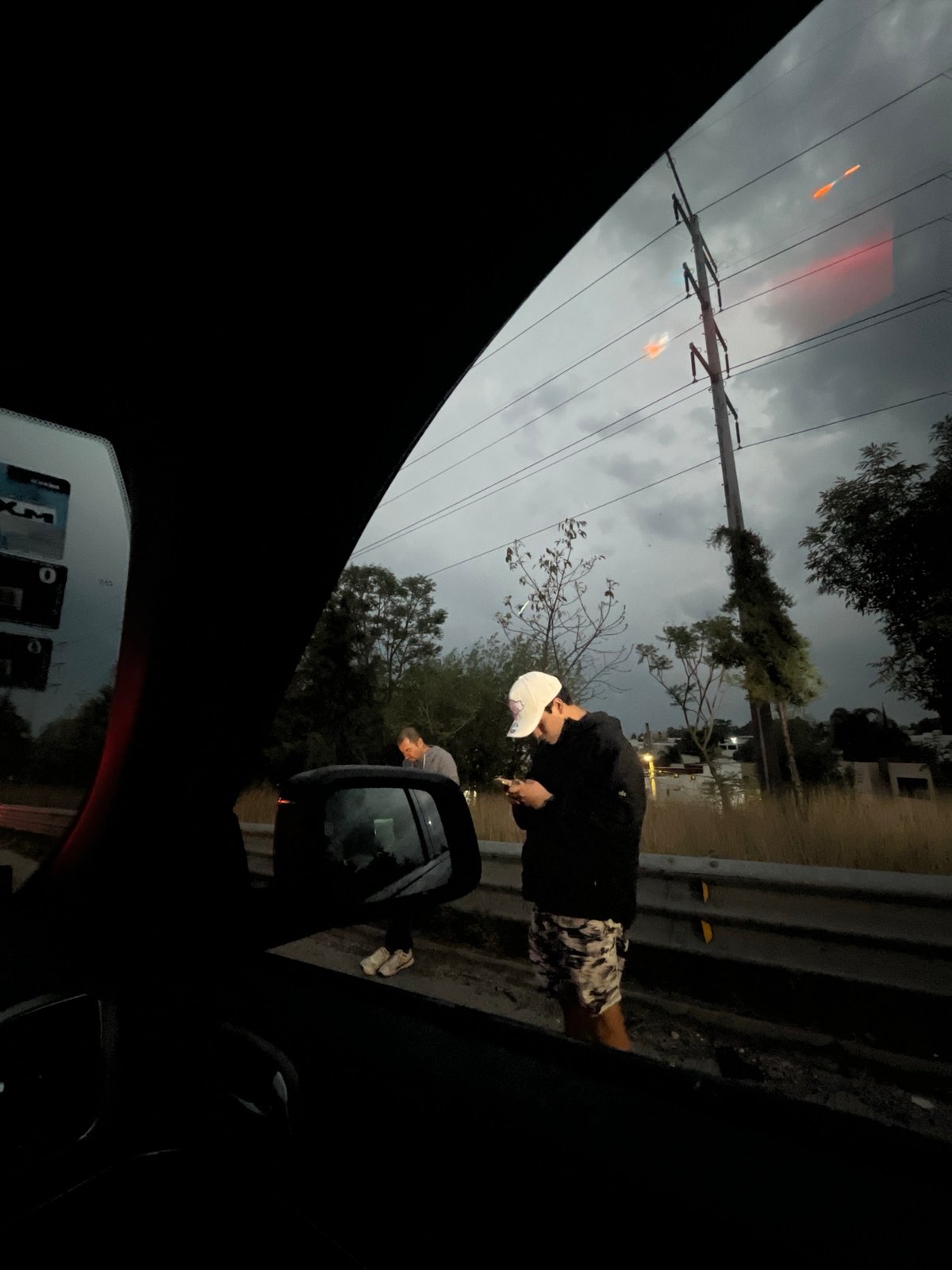 Two people observed roadside in Cholula, Mexico early morning