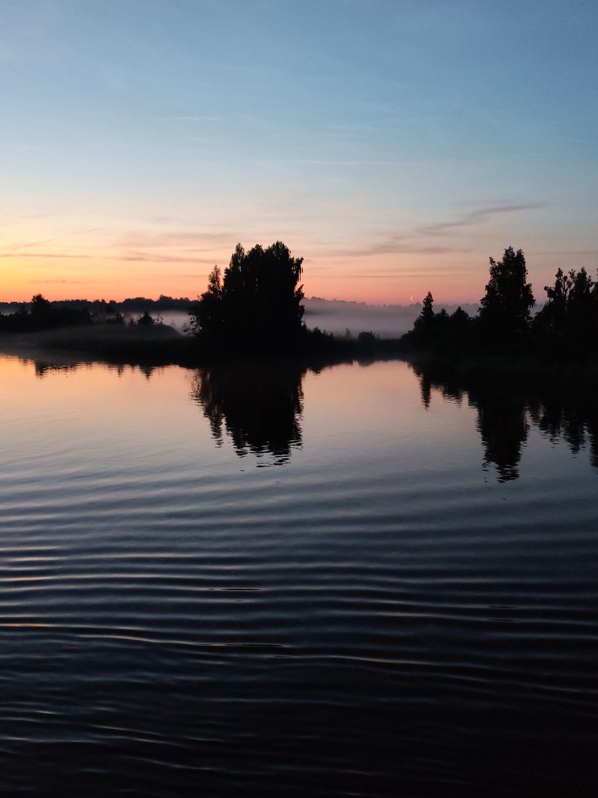 Sunset over the Vytegra River, shot from the water
