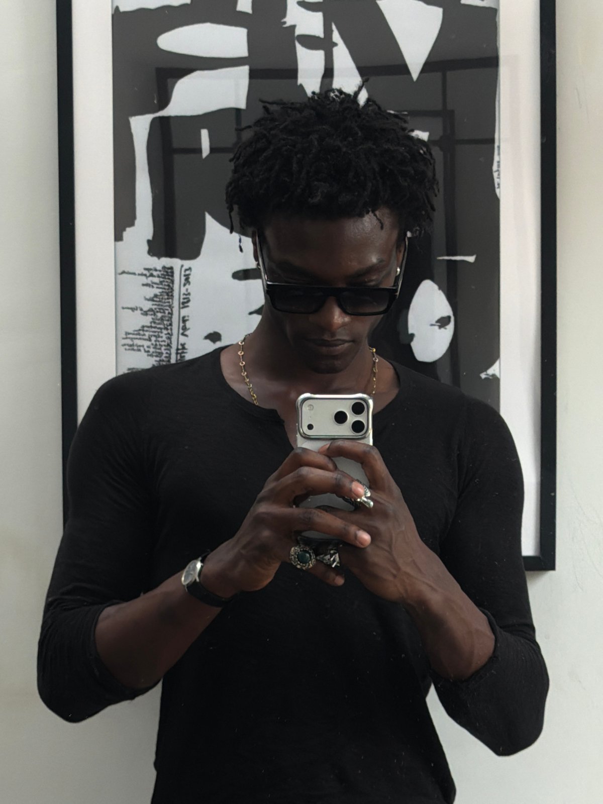 Mirror and artwork selfies from a London interior