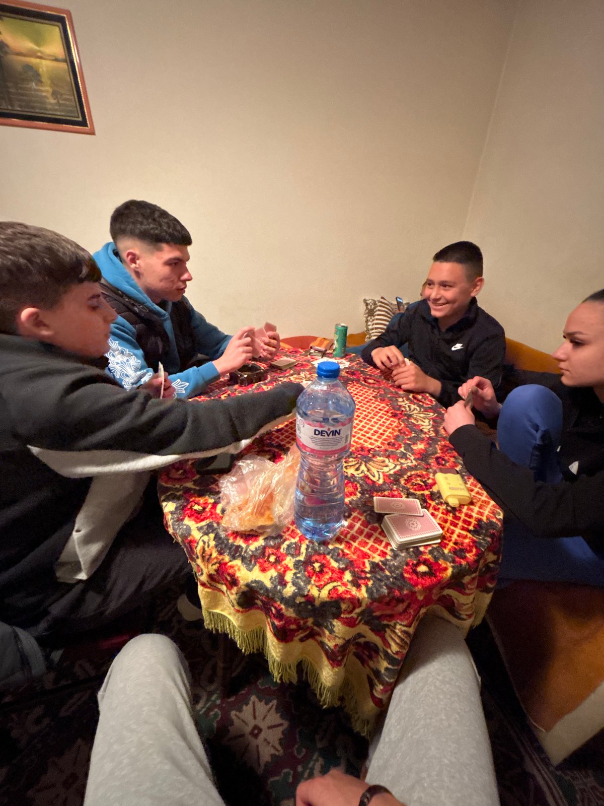 Young men play cards in Goritsa, Bulgaria