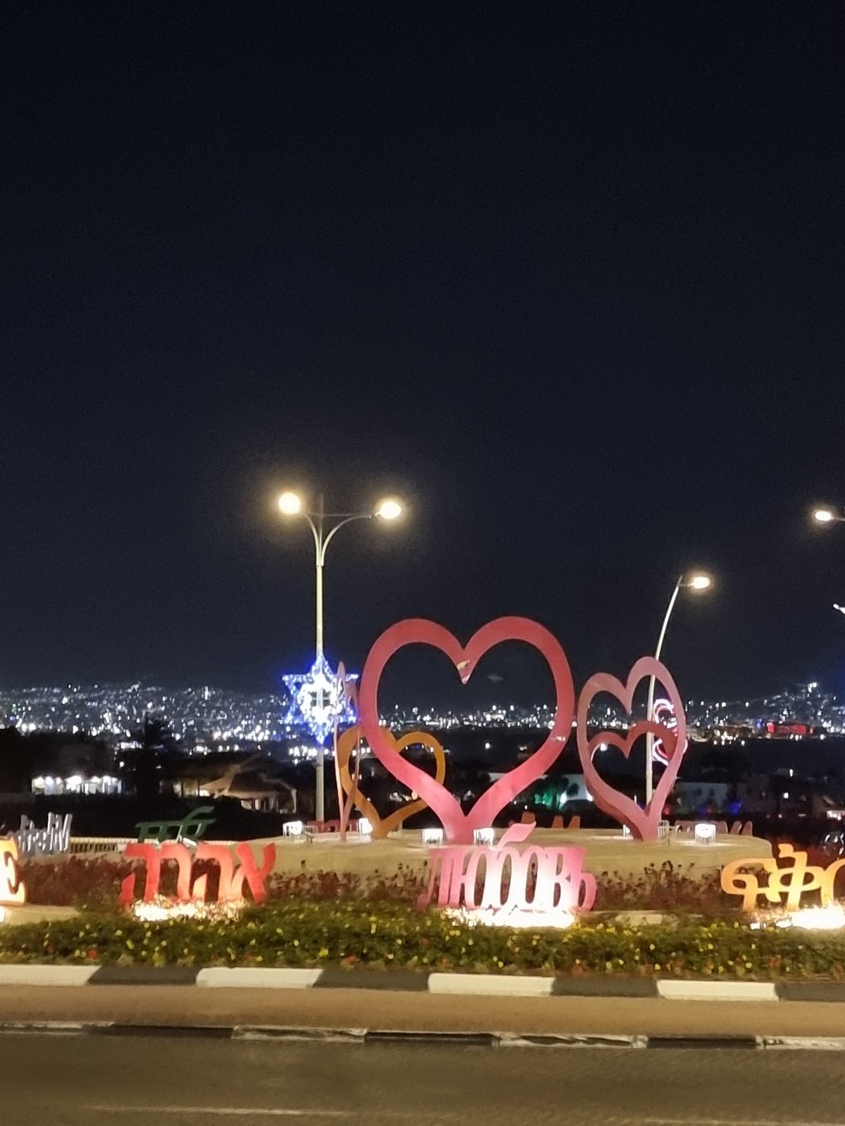 Nighttime scenes captured in Eilat: illuminated decorations, swimming pool
