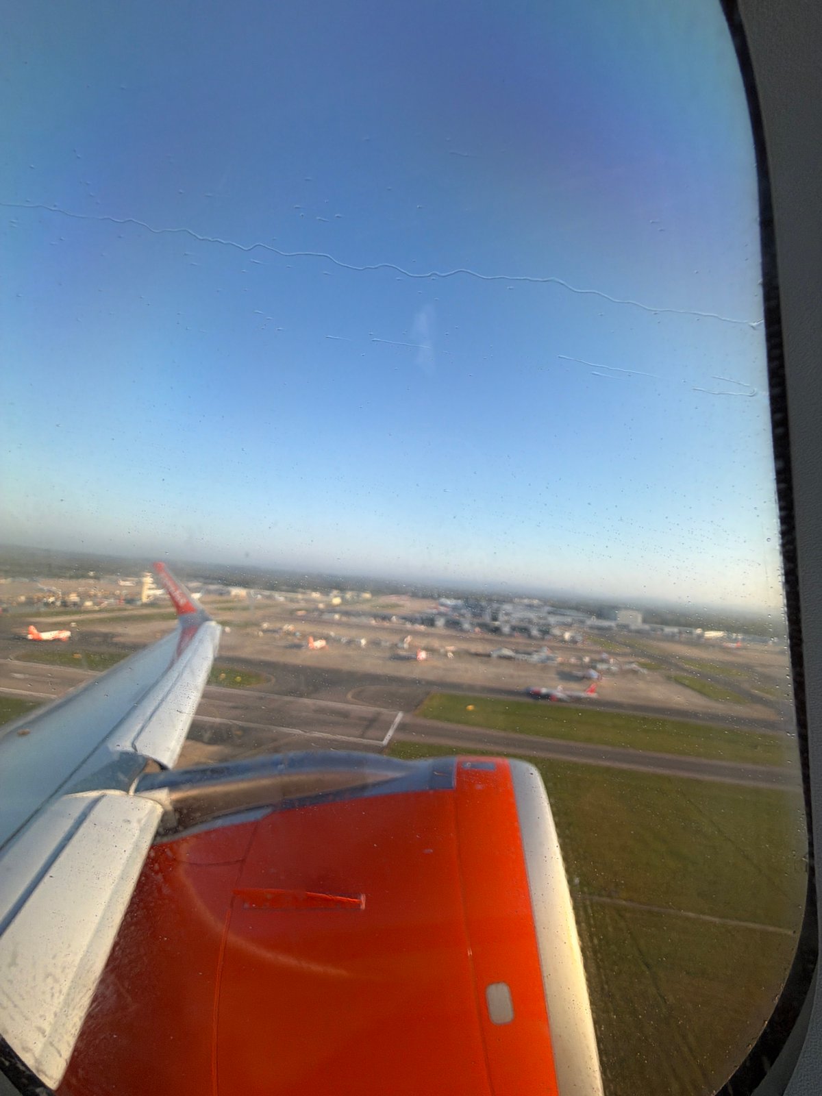 Passenger captures aerial view of UK airport during morning flight