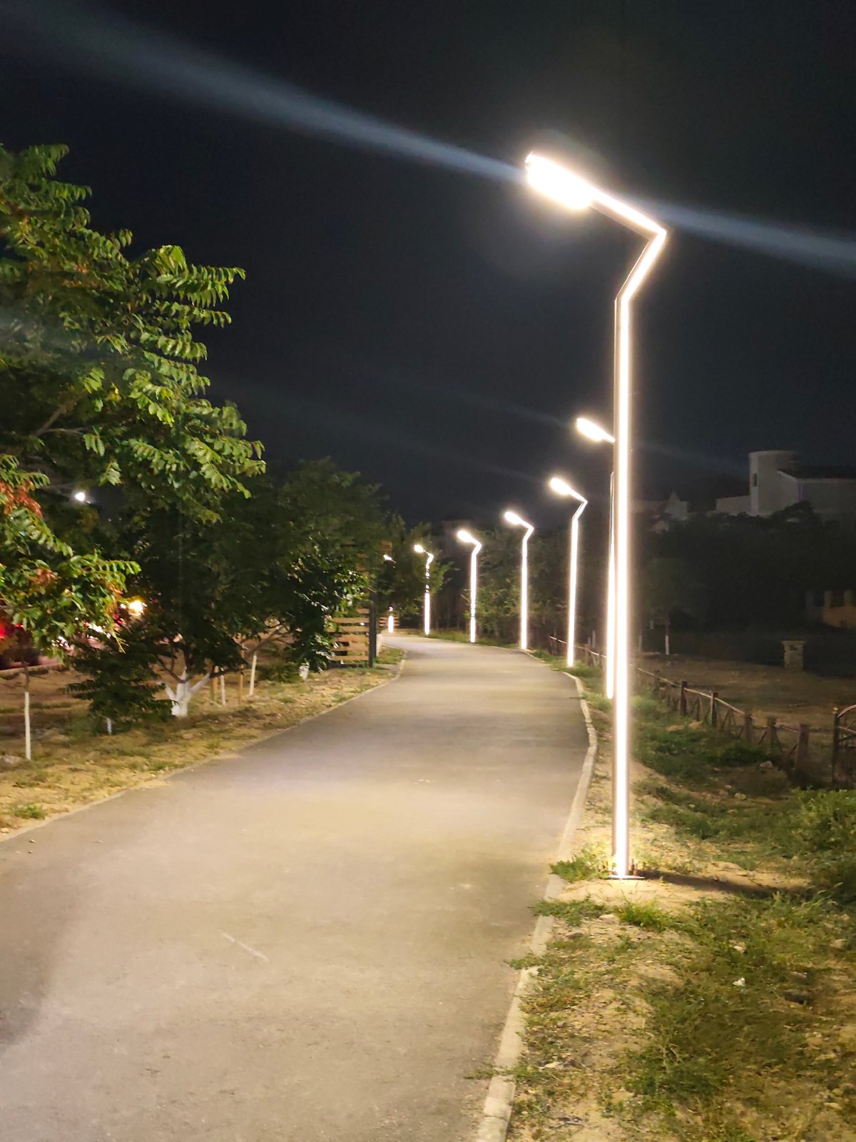 Night walk along a lit promenade in Aktau, Kazakhstan