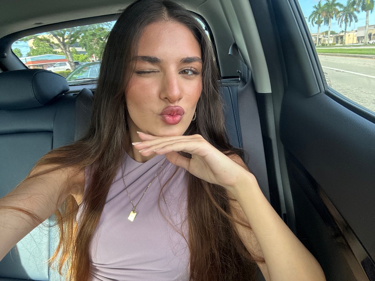 Woman in purple top observed in vehicle backseat, Boca Raton
