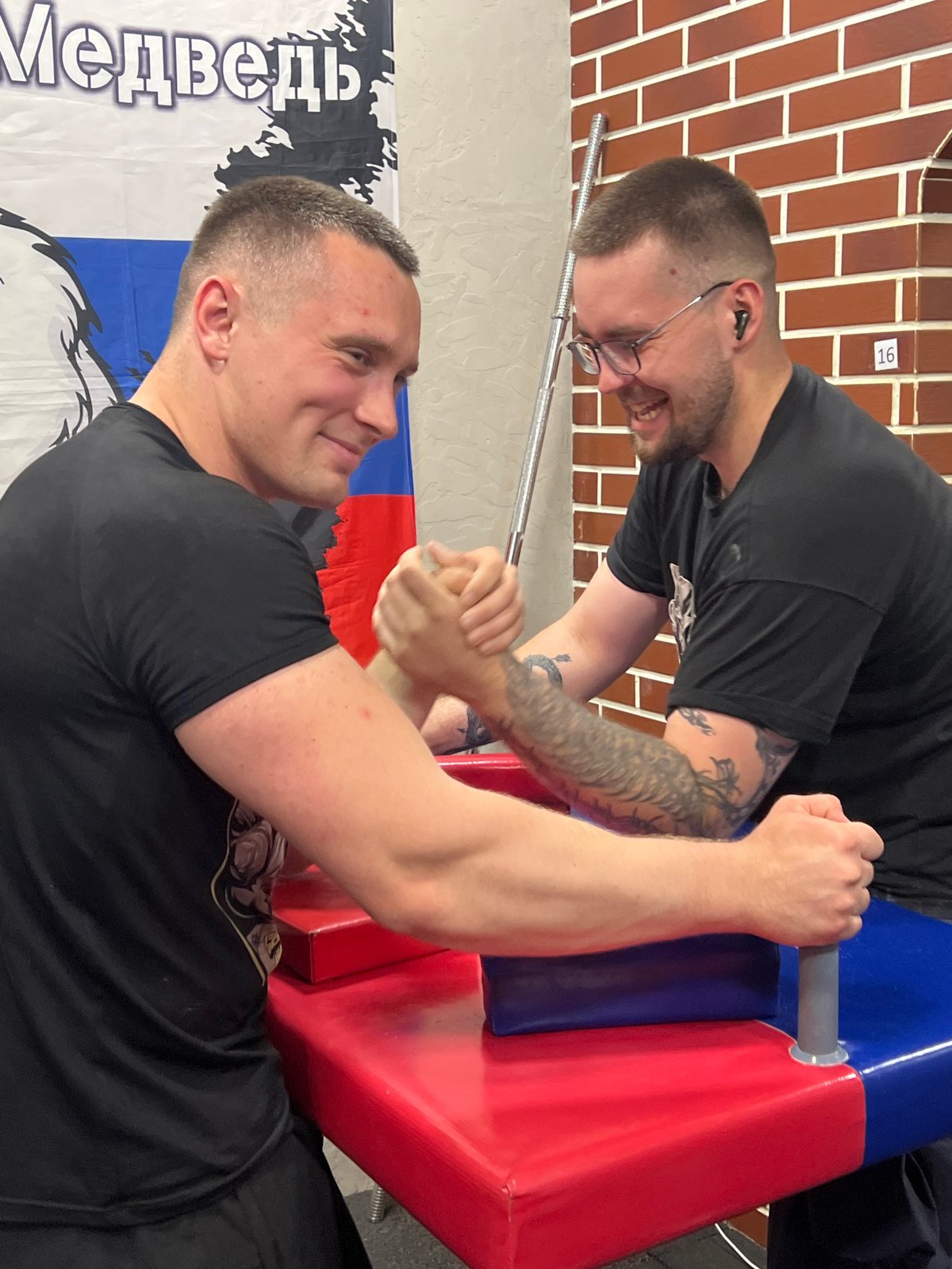 Arm wrestling training session at a Moscow gym