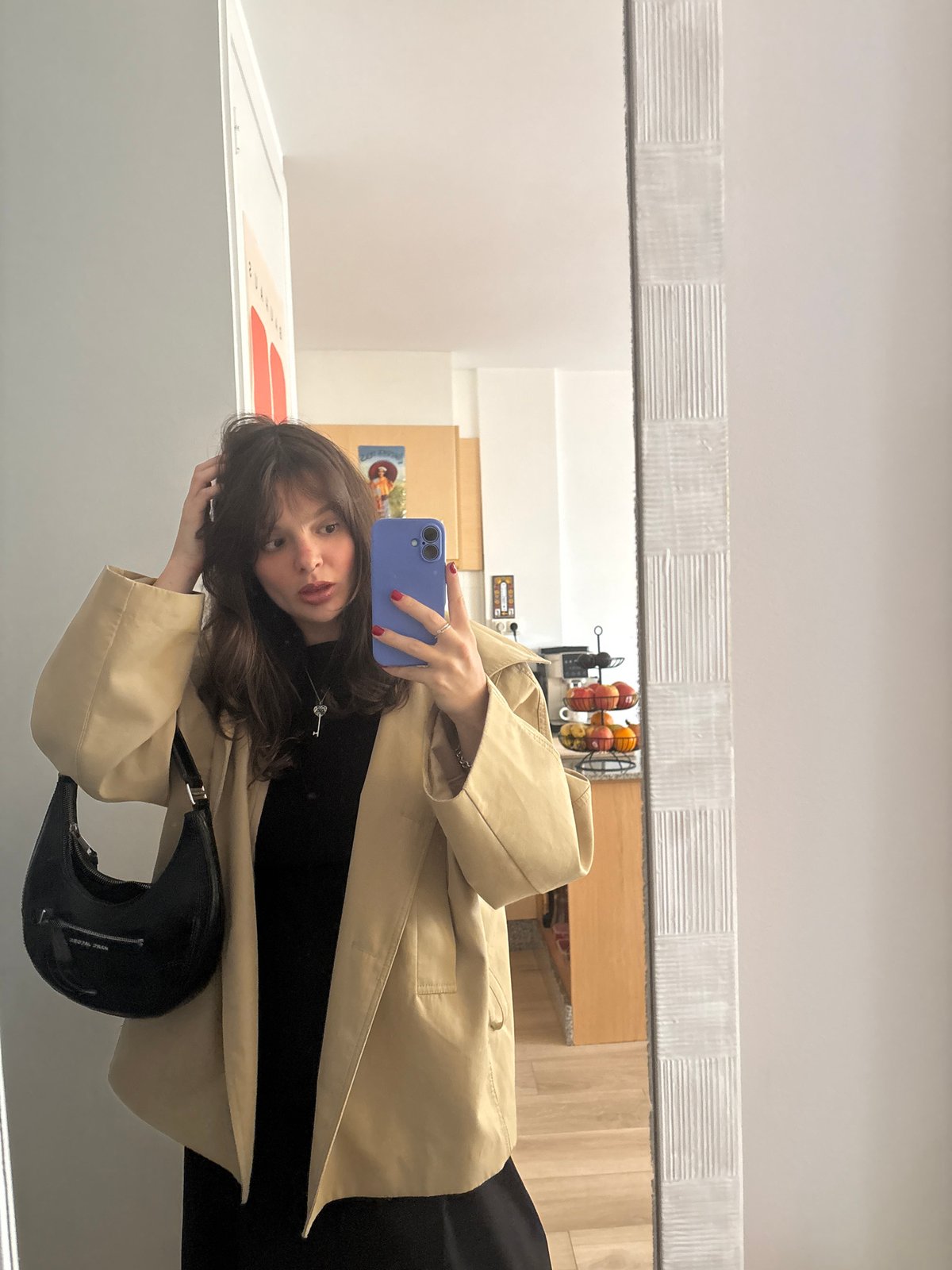Woman takes mirror selfie in Santiago de Compostela
