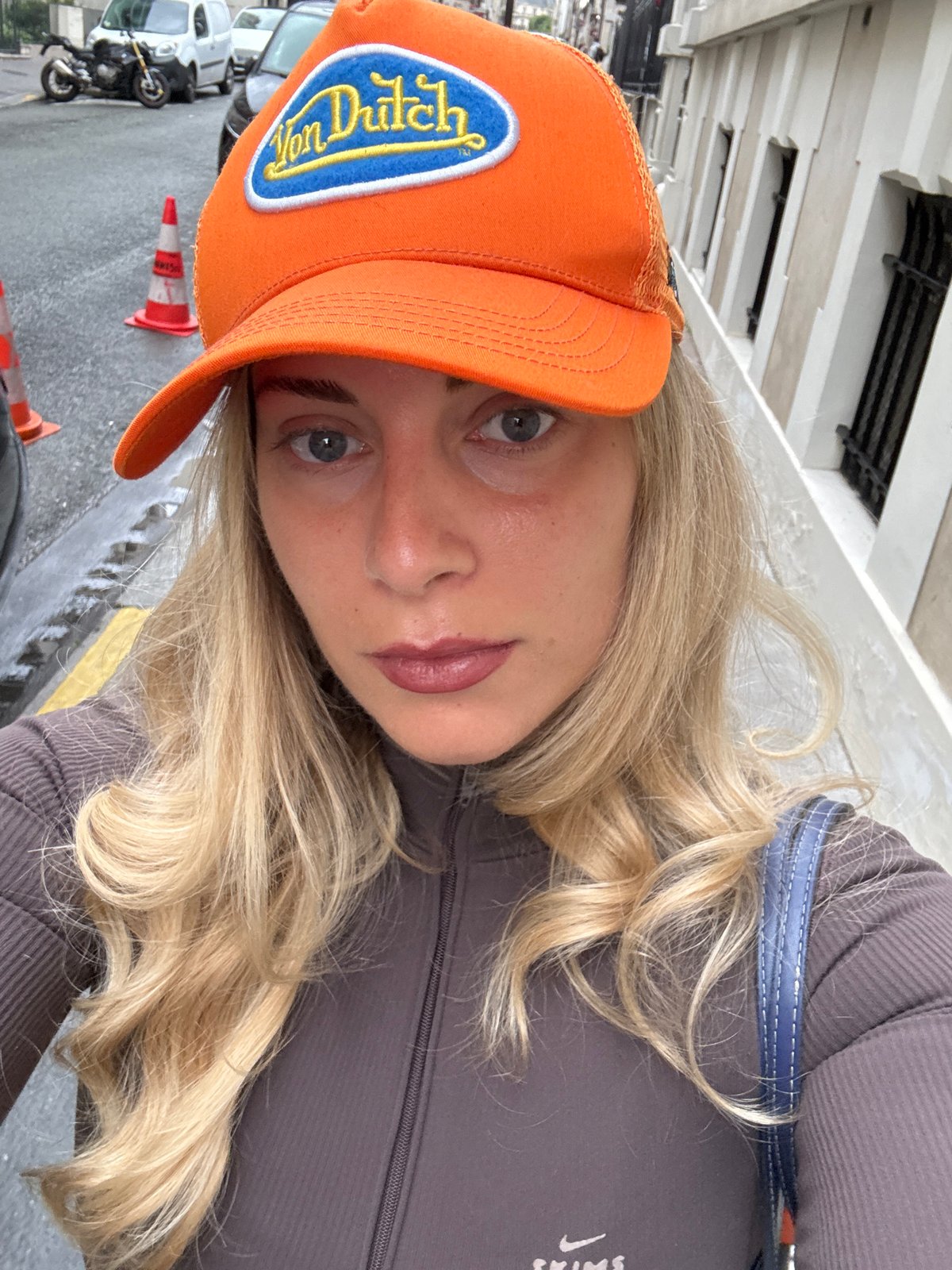 Woman in Orange Von Dutch Cap Photographed in Paris