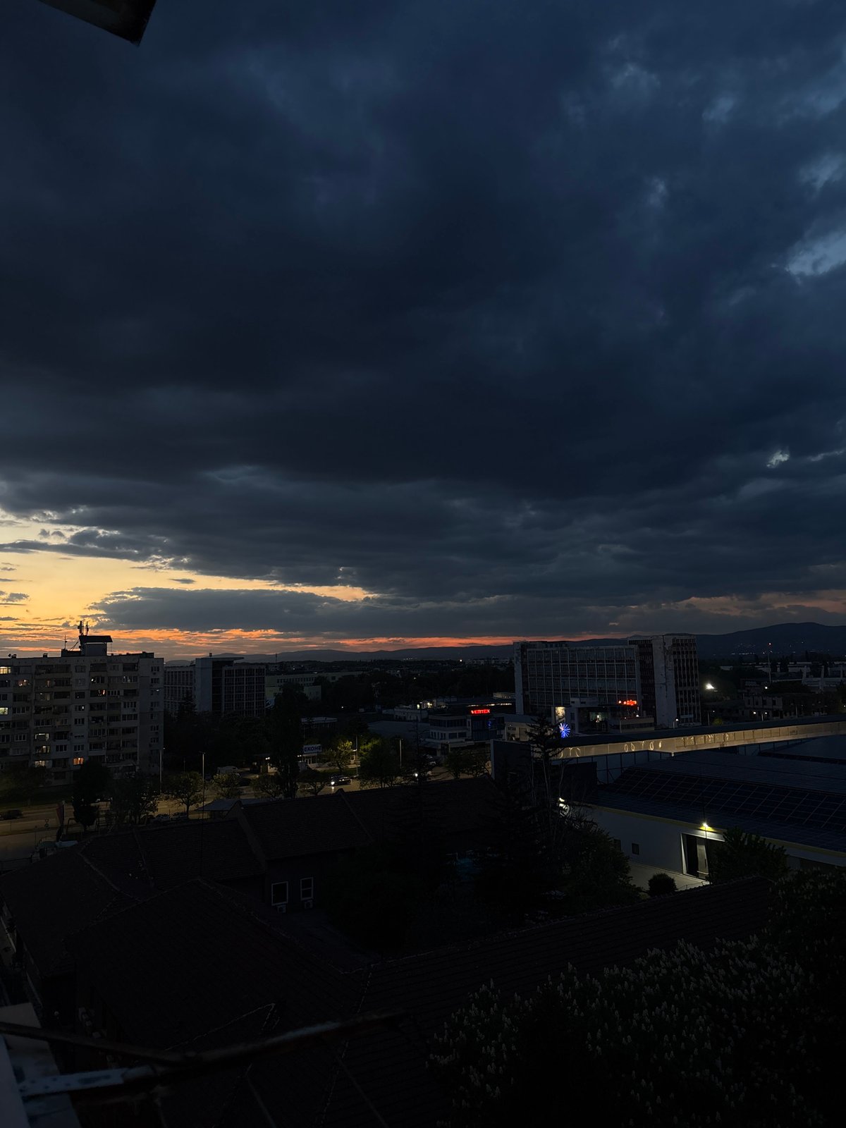 Evening cannabis session on Sofia balcony during storm