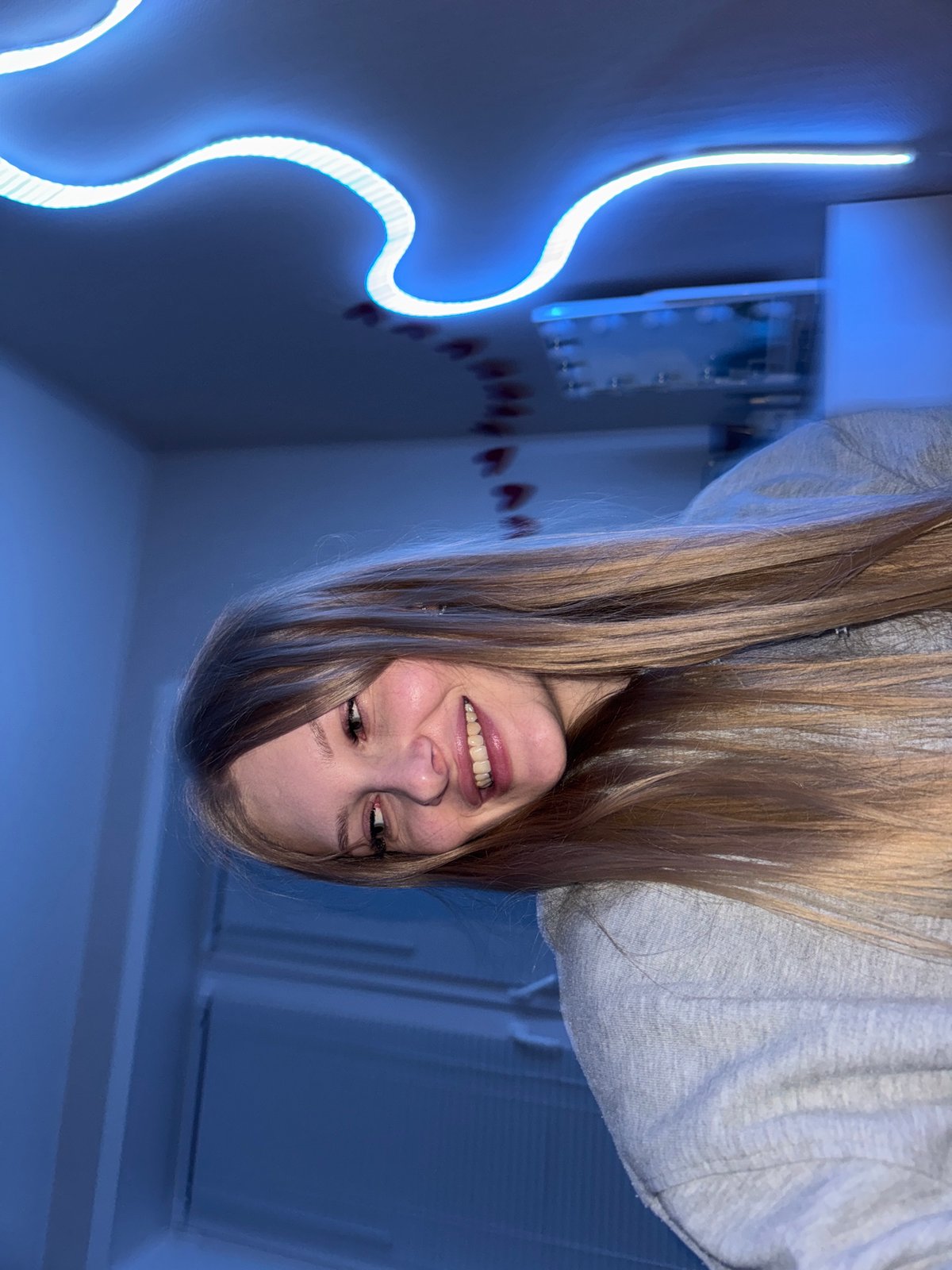 Portrait session in a neon-lit room in Perm