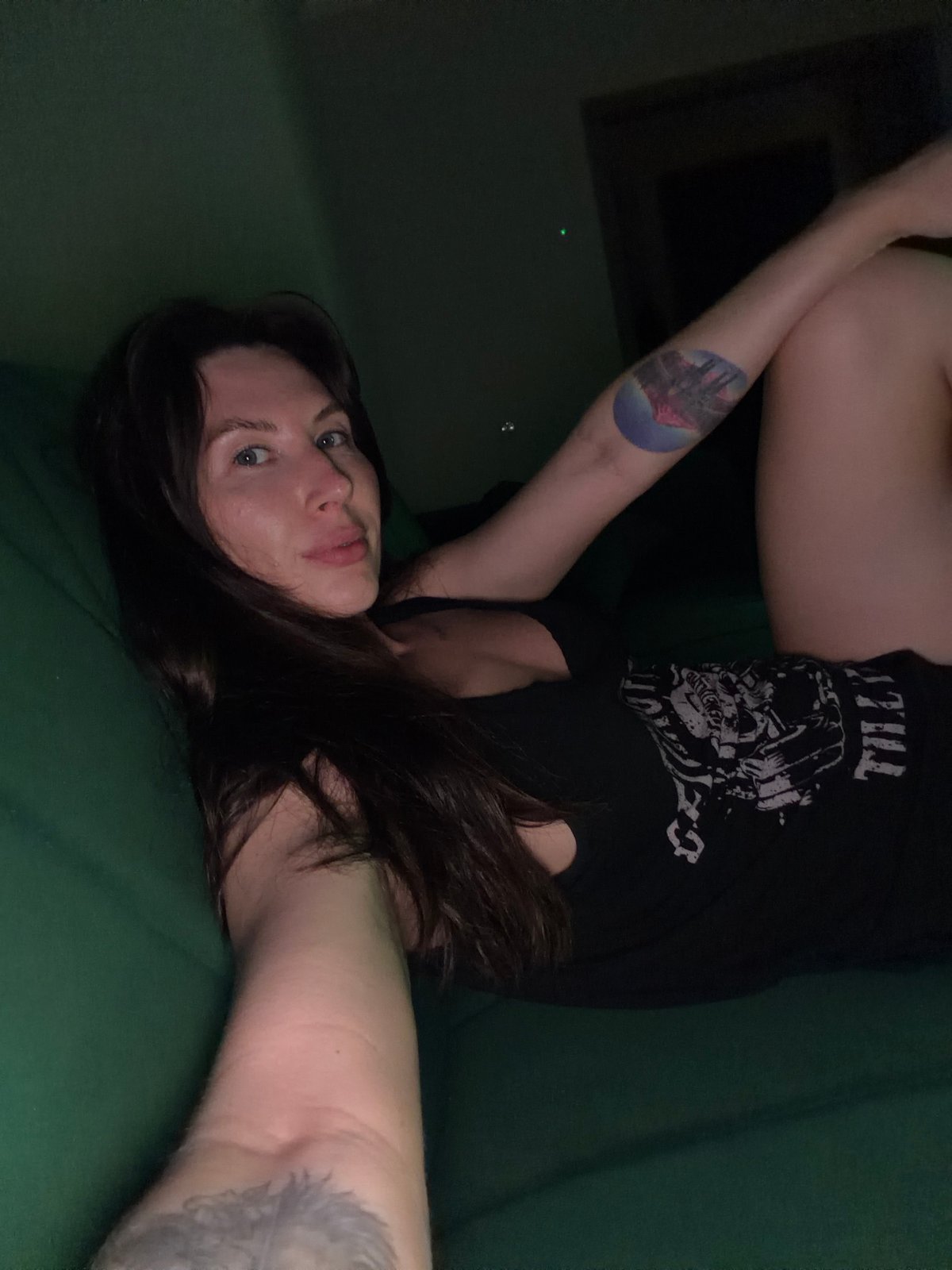 Relaxing on a green couch in Perm, casual selfie session