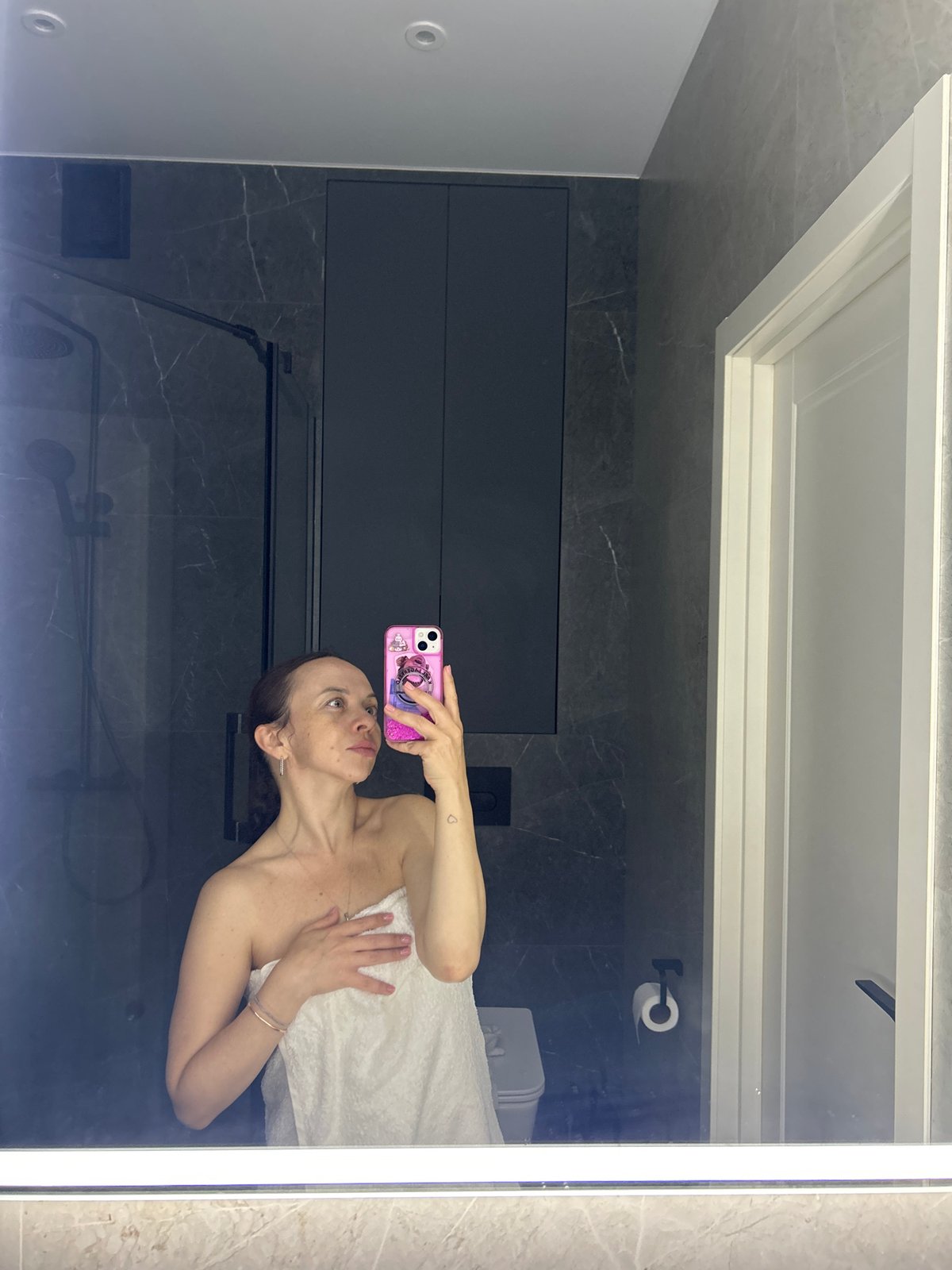 Woman documents evening routine in bathroom selfies in Yekaterinburg