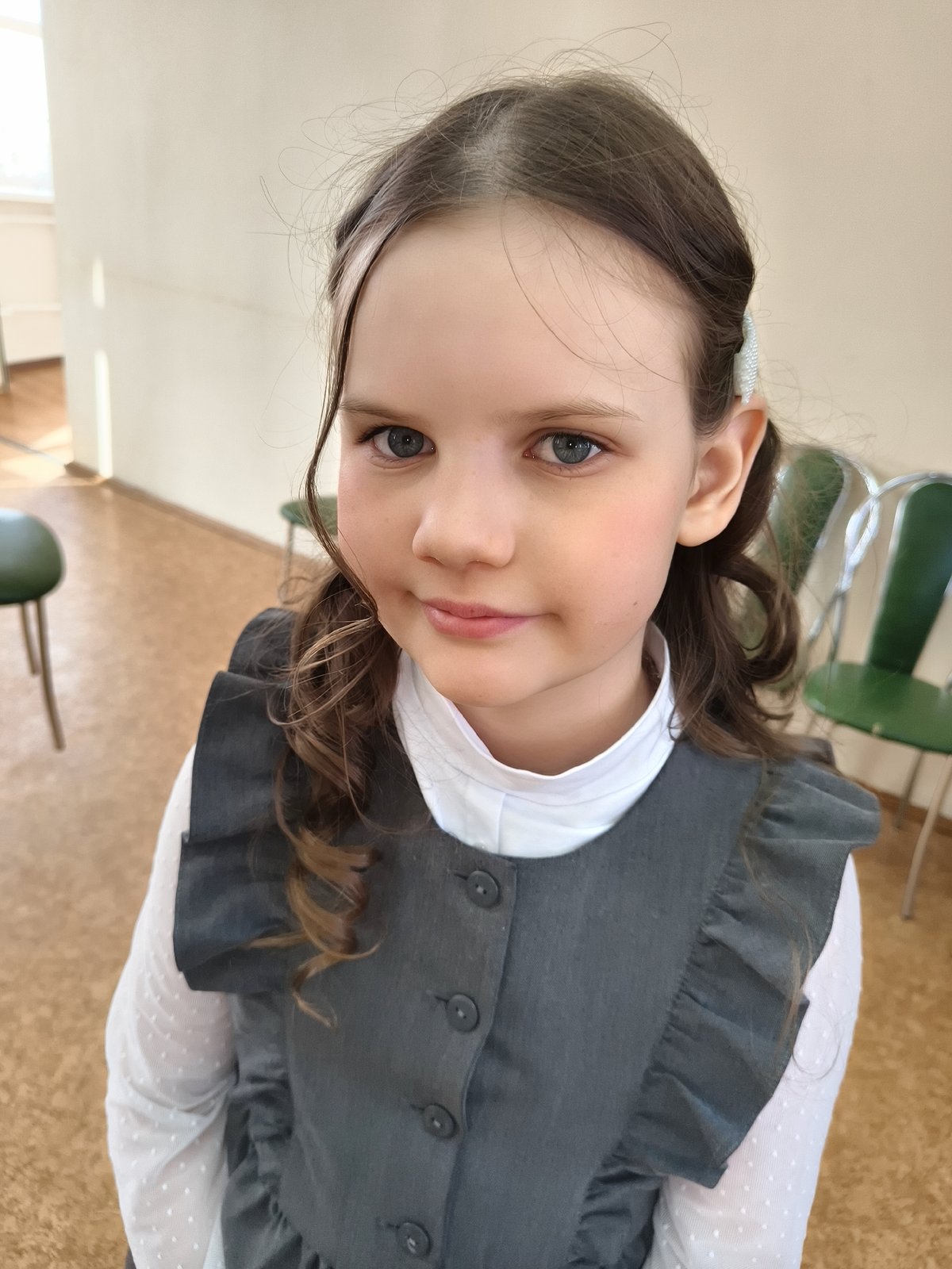 Young girl performs solo singing act on wooden stage