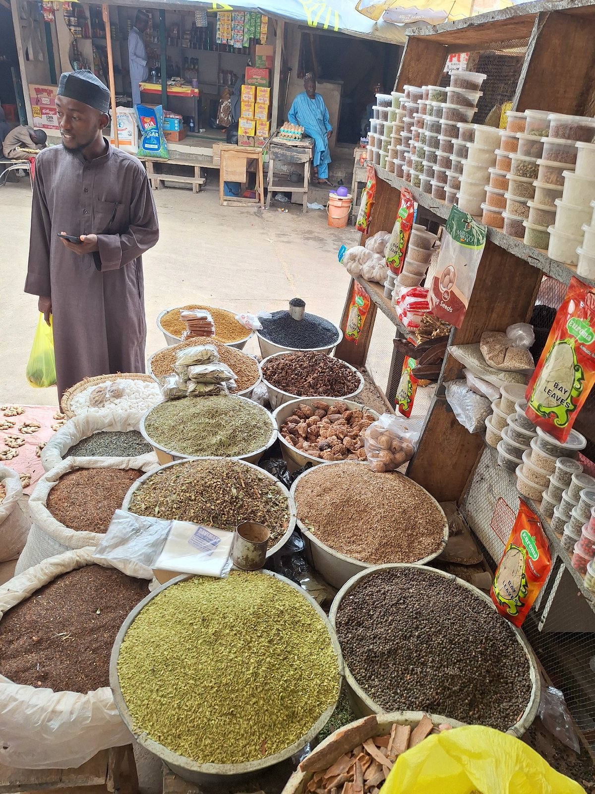 Busy spice market documented in Maiburiji, Nigeria morning hours
