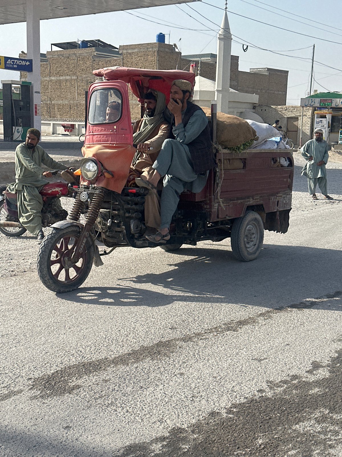Three-wheeler carries passengers and goods in Quetta, Pakistan