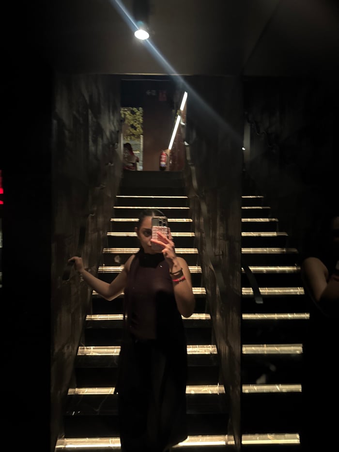 Person takes selfies in multiple rooms in Madrid location