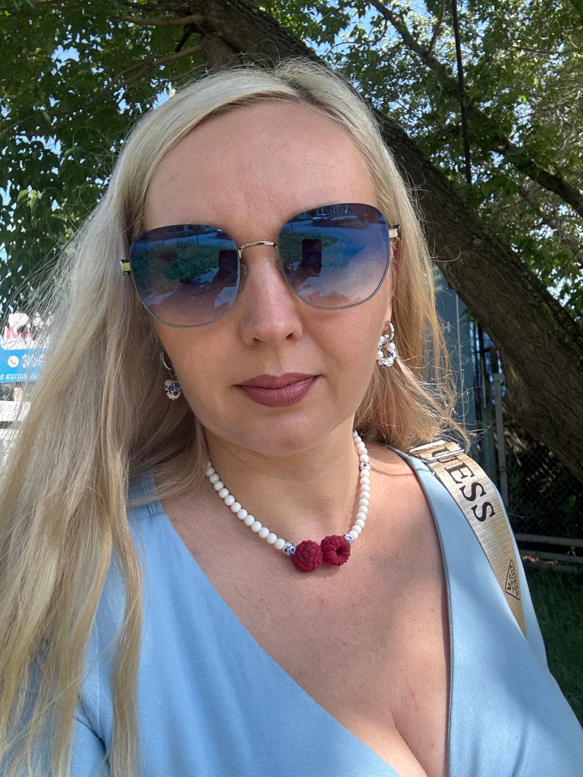 Close-up portrait with raspberry charm necklace in Komsomolsk-on-Amur