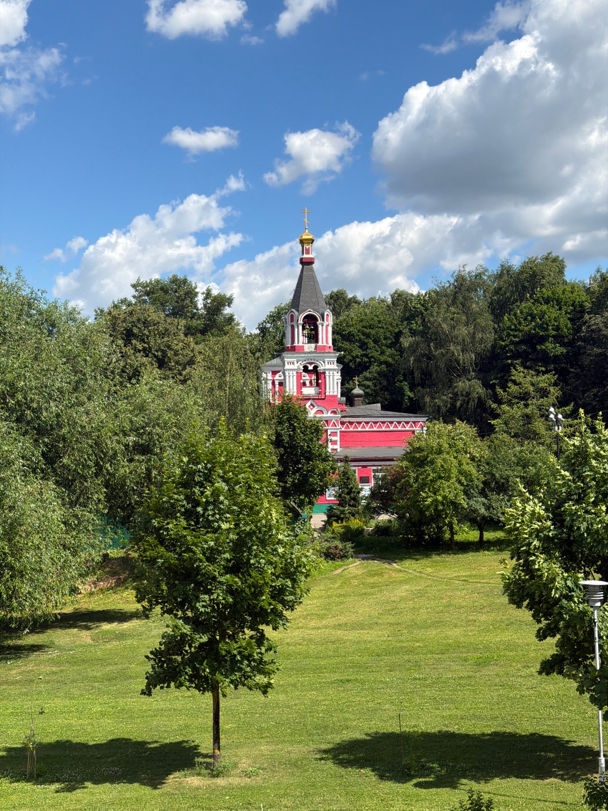 Moscow park outing with a church, wildflowers, and playground fun
