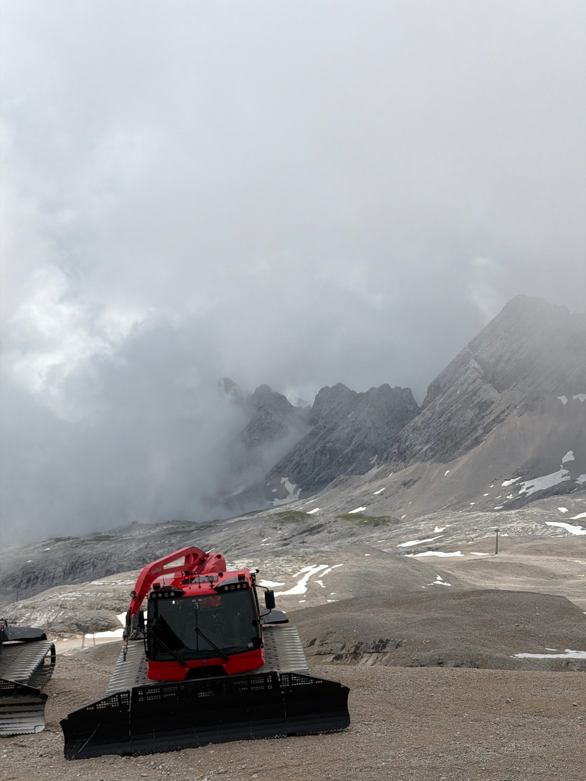 Foggy summer morning at a high Alpine summit in Garmisch-Partenkirchen