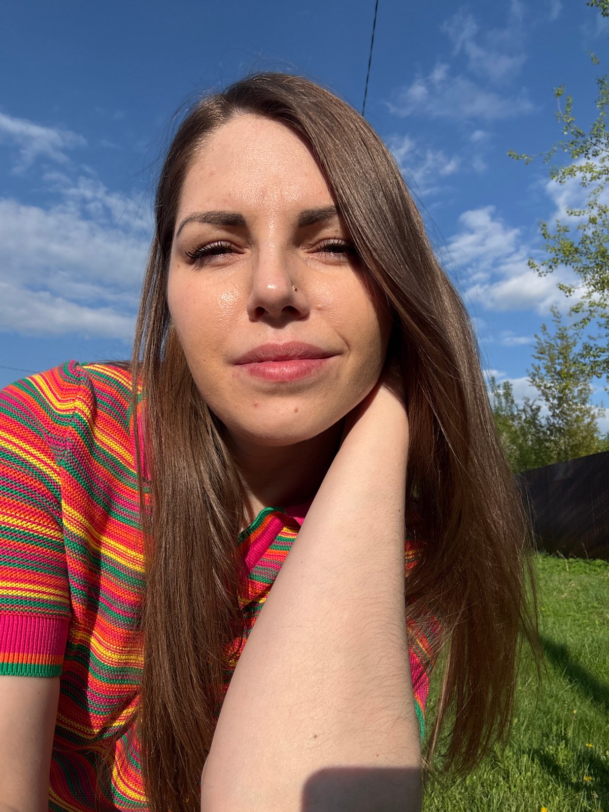 Woman documents springtime family moments in Russian village playground