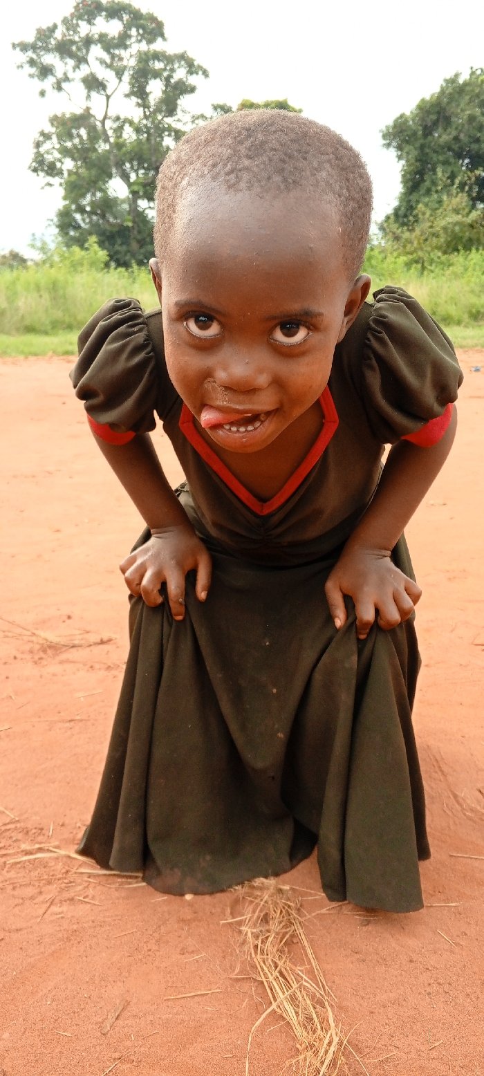 Aid worker distributes supplies to children in DRC villages