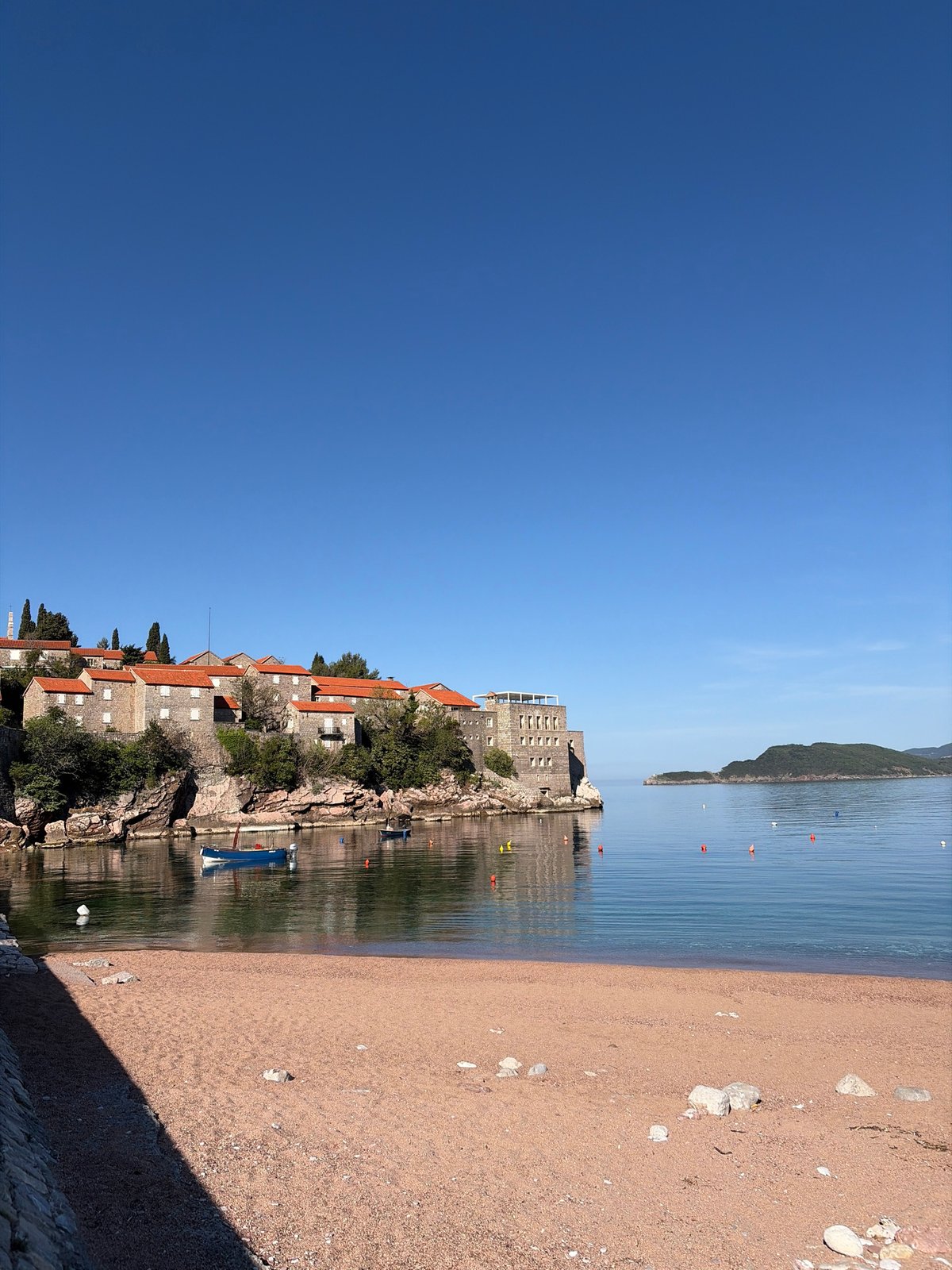 Morning tourism at Montenegro's iconic Sveti Stefan island captured