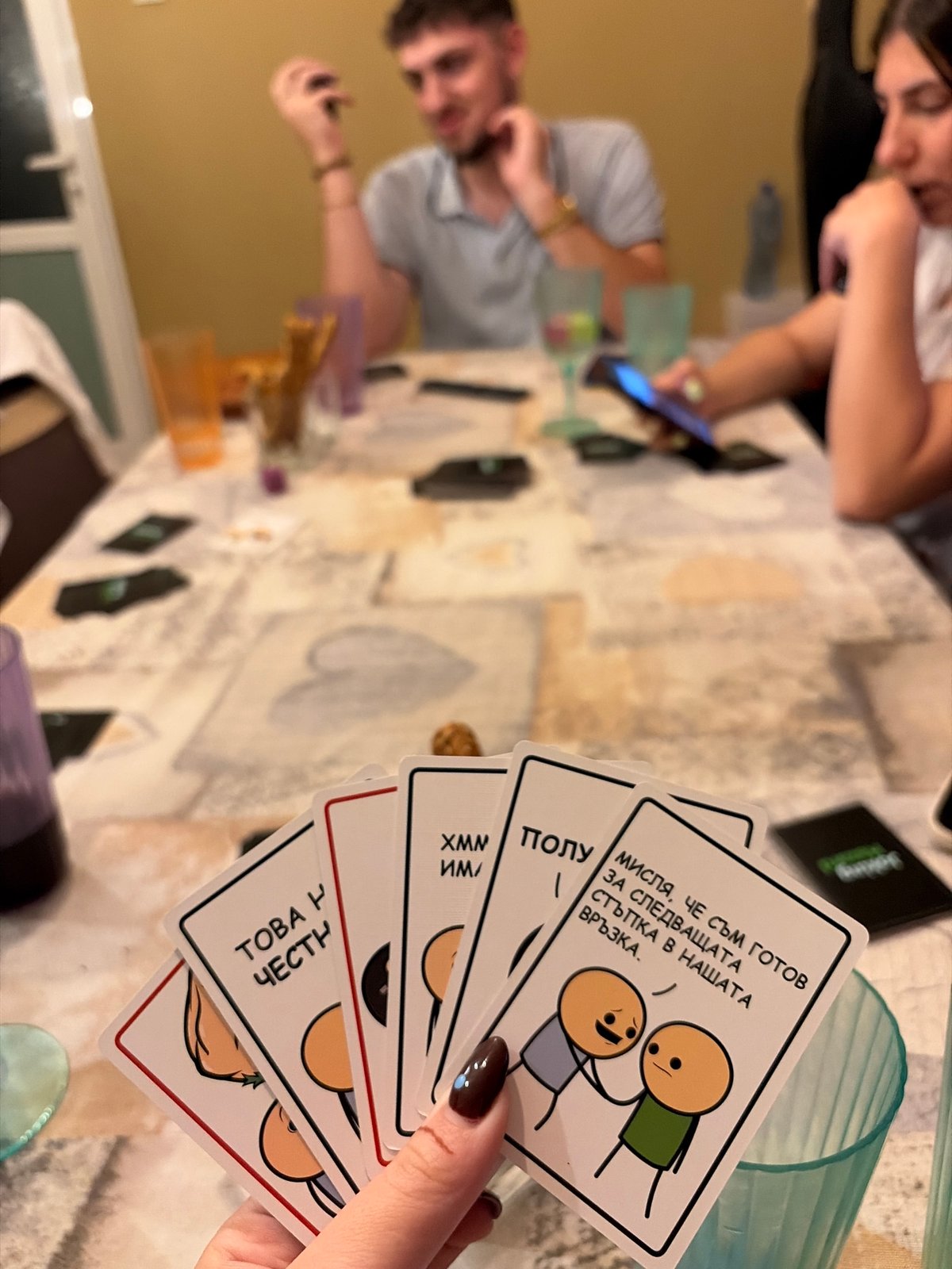 Friends play Joking Hazard card game in Plovdiv home