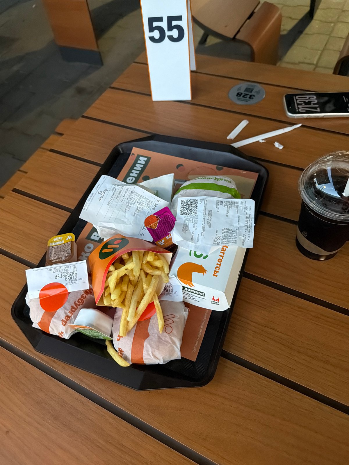 Fast food, a parked Jaguar, and a bold graphic in Moscow