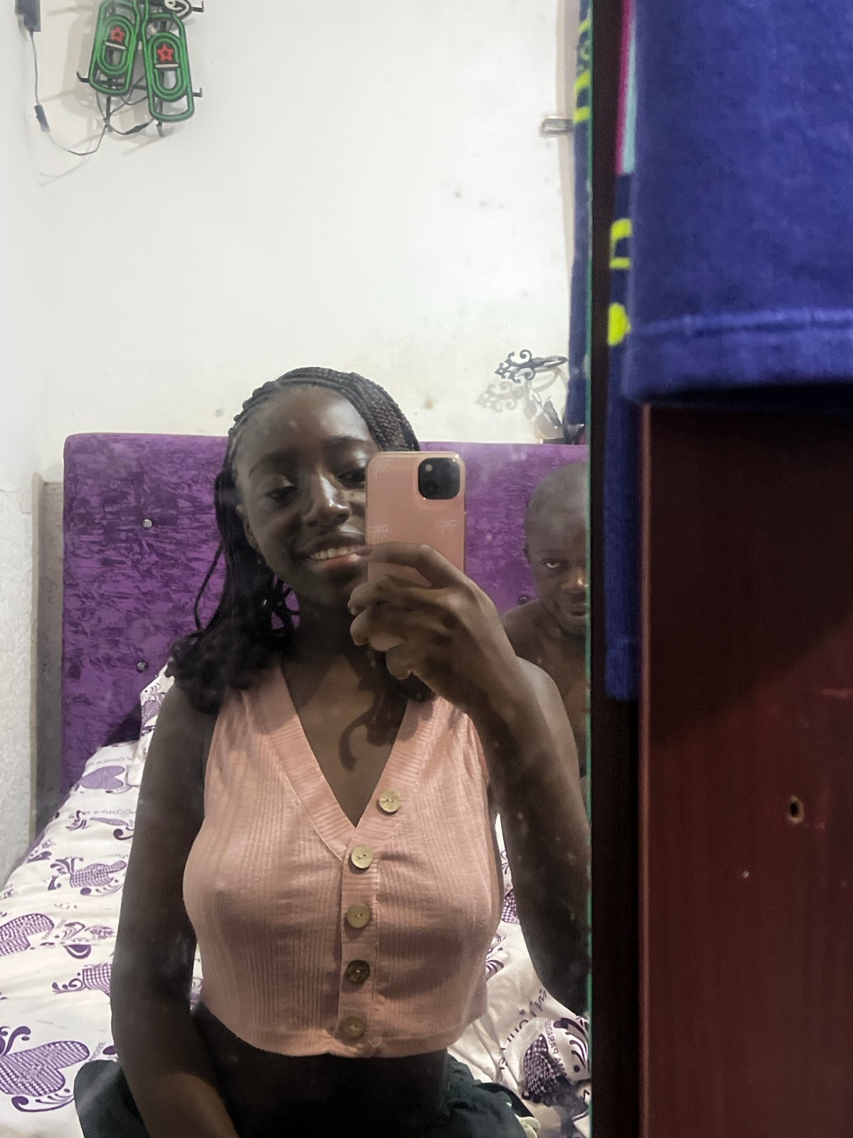 Woman takes morning selfie in Abuja bedroom