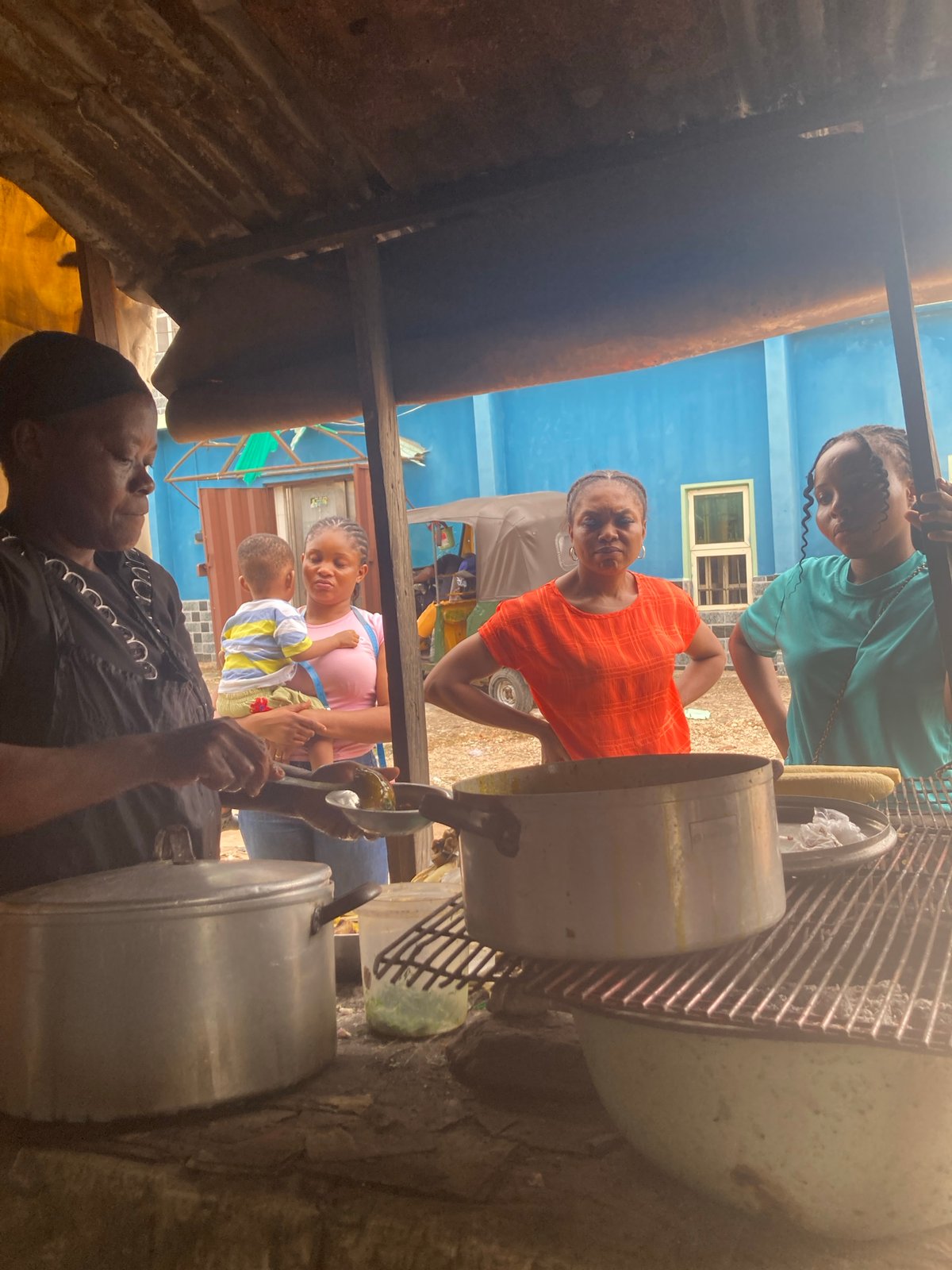 Midday street food vendors operate in Aba, Nigeria