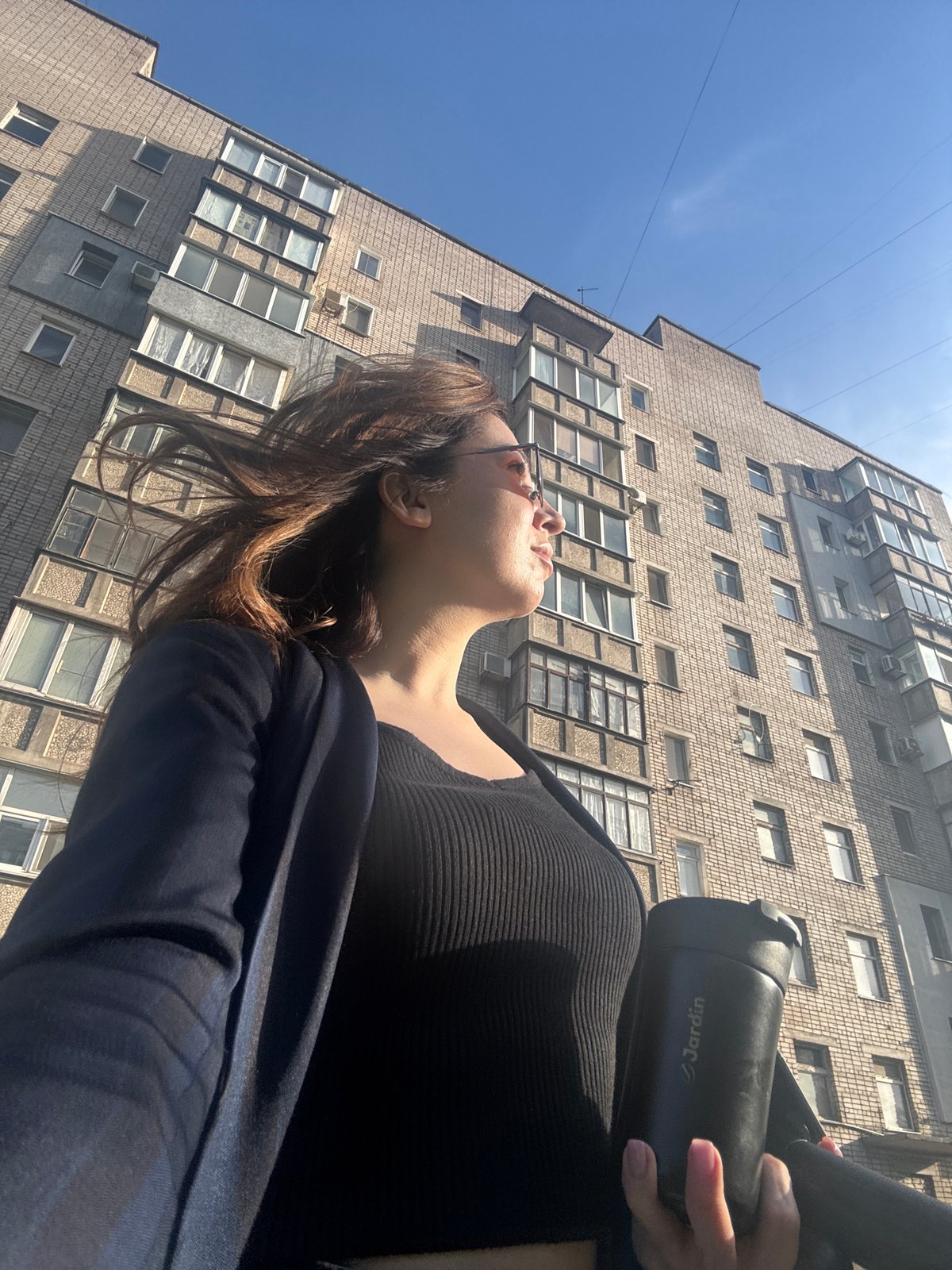 Woman with thermos spotted near building in Kryvyi Rih