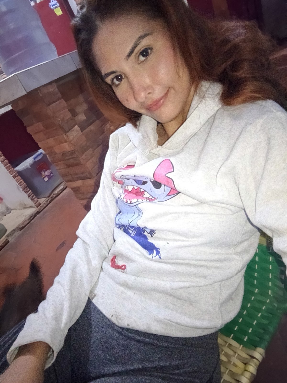 Woman takes late-night selfies with dog in Venezuelan home