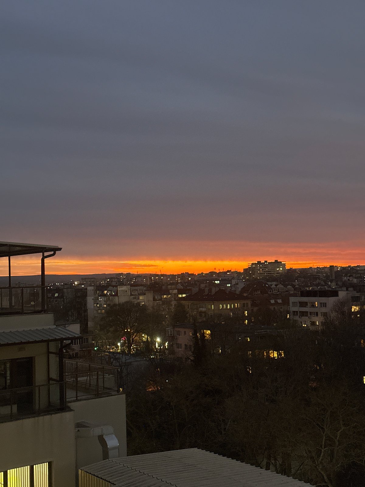 Evening sunset observed over Varna cityscape from elevated viewpoint