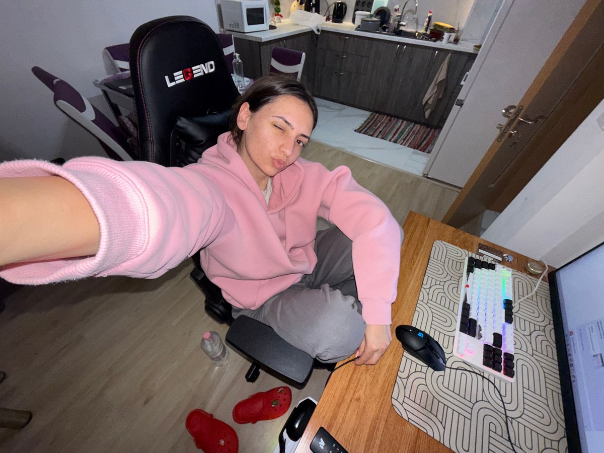Person takes winking selfie in gaming chair, Plovdiv kitchen