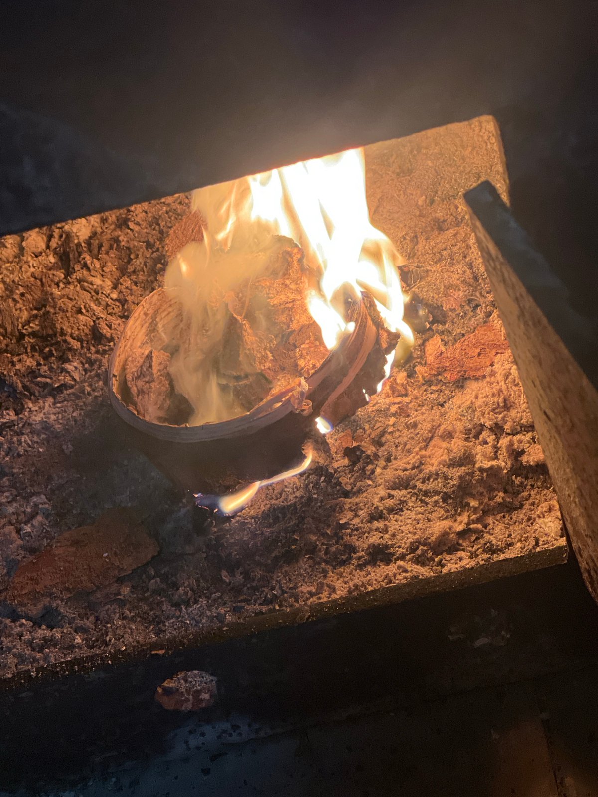 Traveler with suitcase navigates snowy Chaikovsky, tends indoor fire