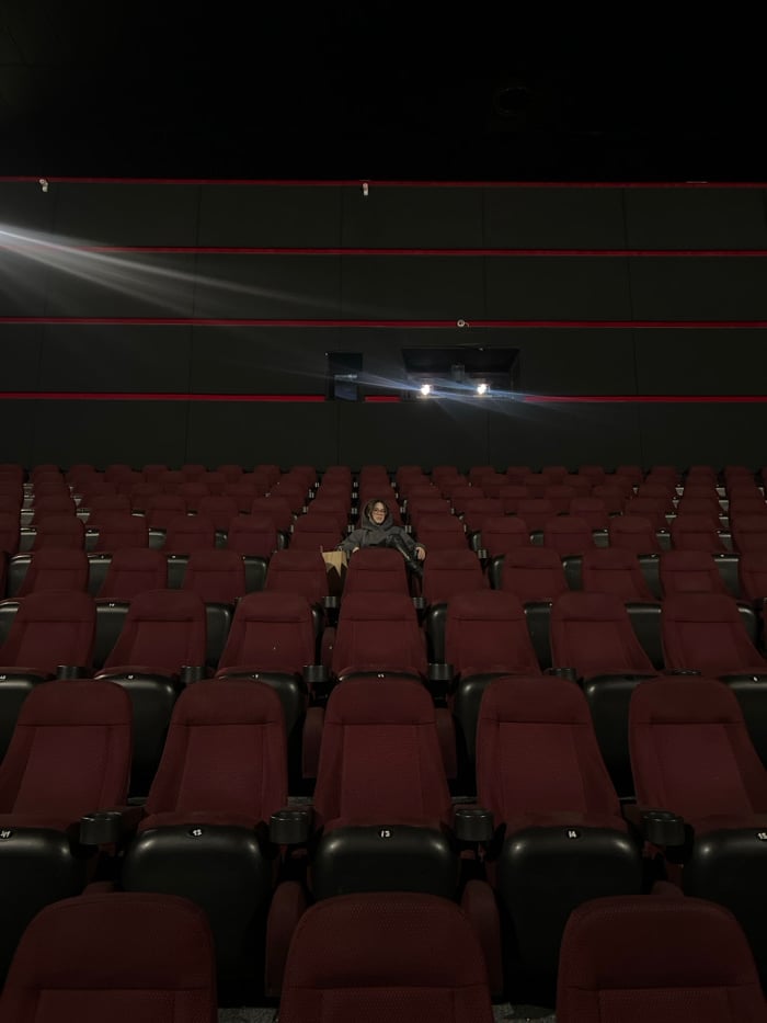 Lone moviegoer sits in empty Odesa cinema hall