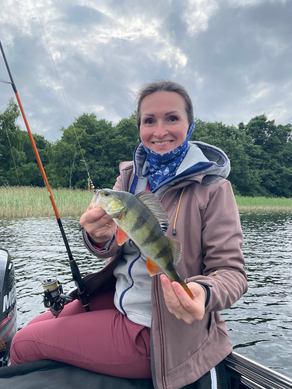 Fresh catch on a Russian lake, summer afternoon fishing