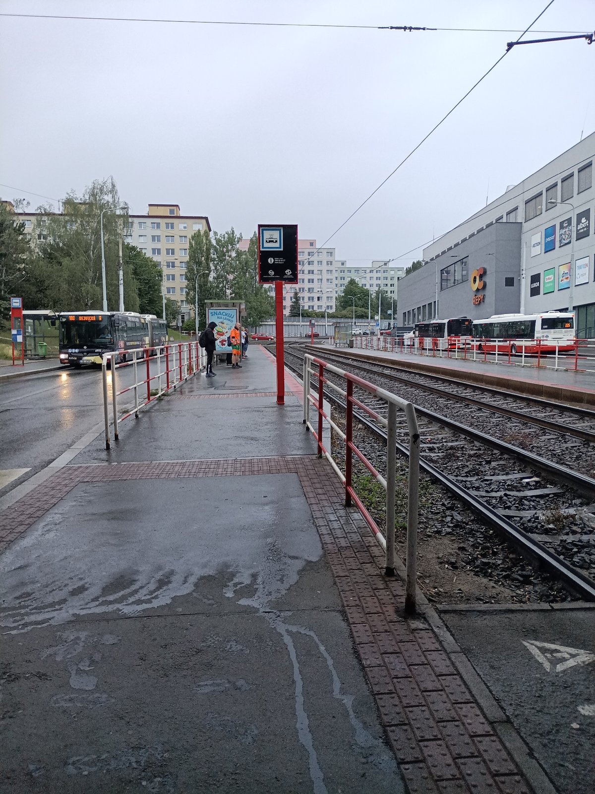 Rainy tram stop selfies near OC Řepy, Prague