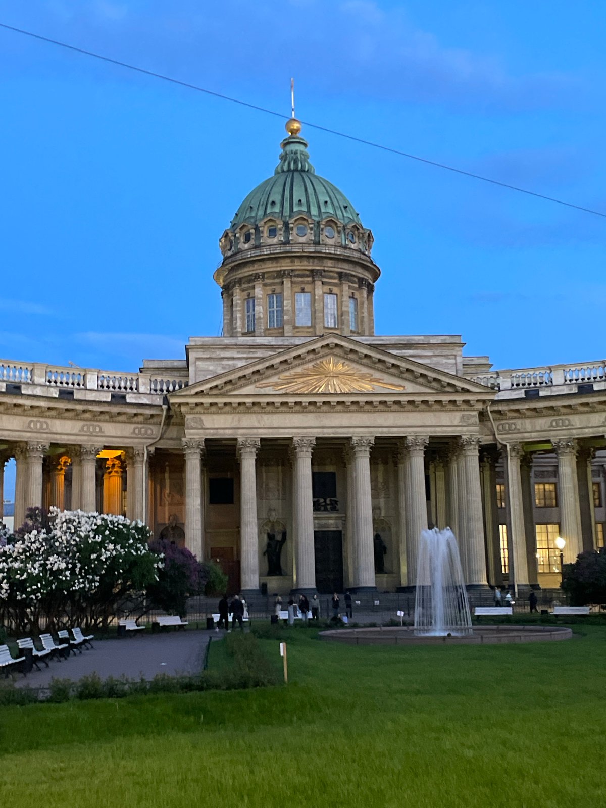 Tourist documents evening stroll near Kazan Cathedral in Saint Petersburg