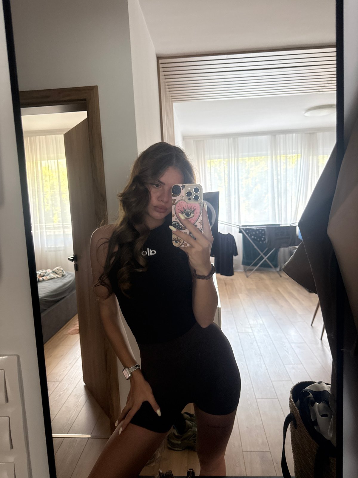 Mirror selfie session across two rooms in Plovdiv