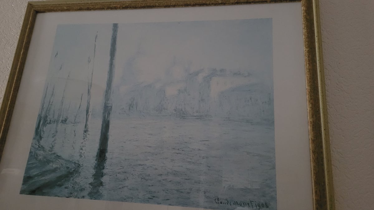 Nautical and winter paintings alongside a birthday banner