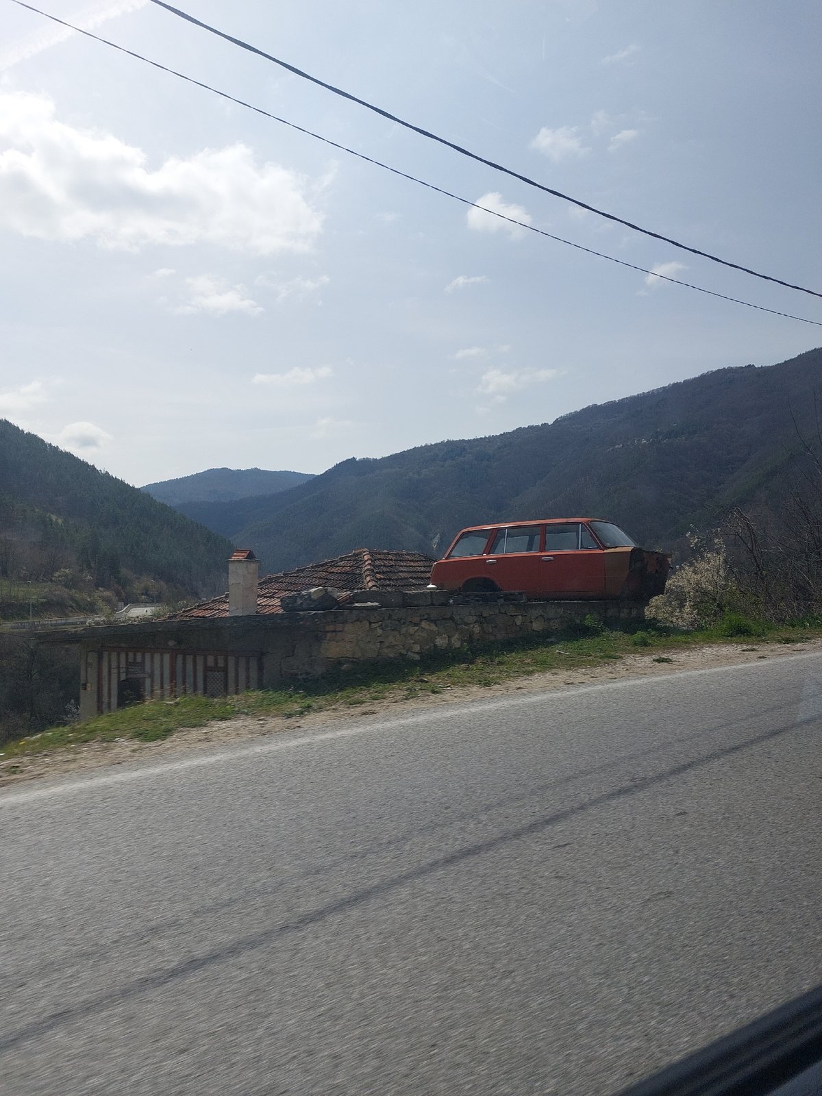 Vintage orange car spotted roadside in Mihalkovo, Bulgaria
