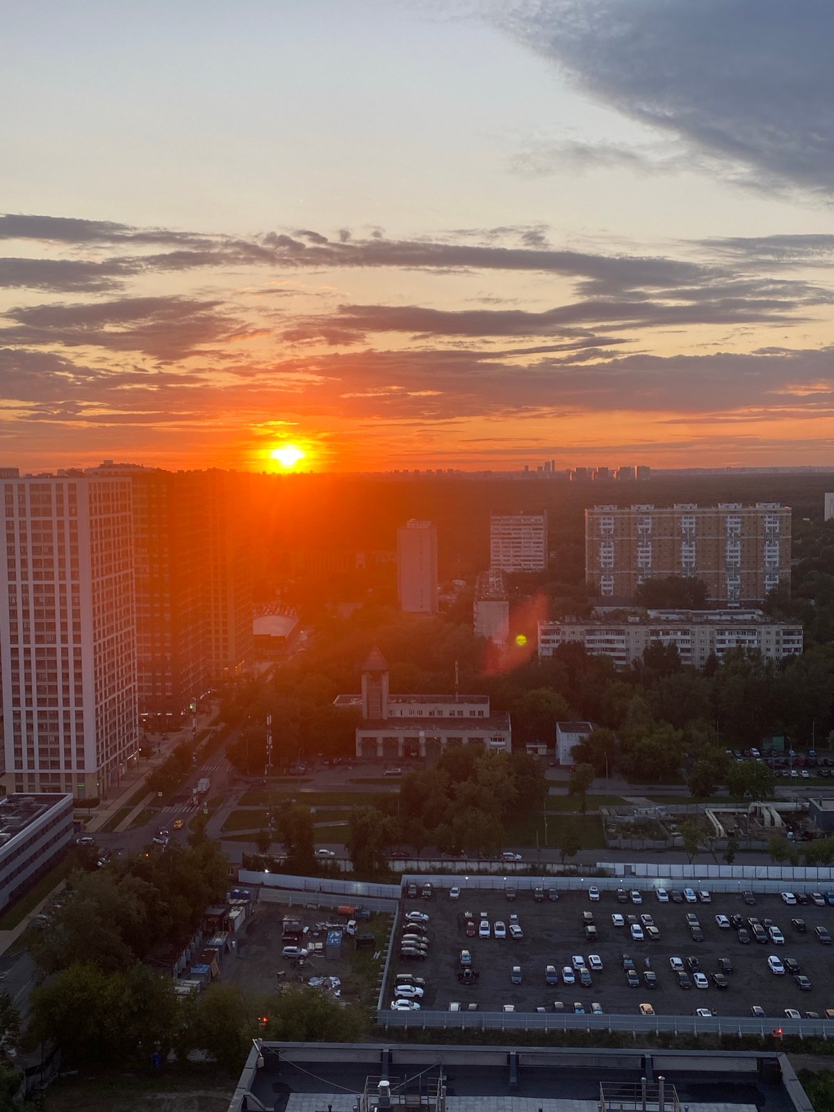 Moscow sunset, indoors and out, with a parrot in frame