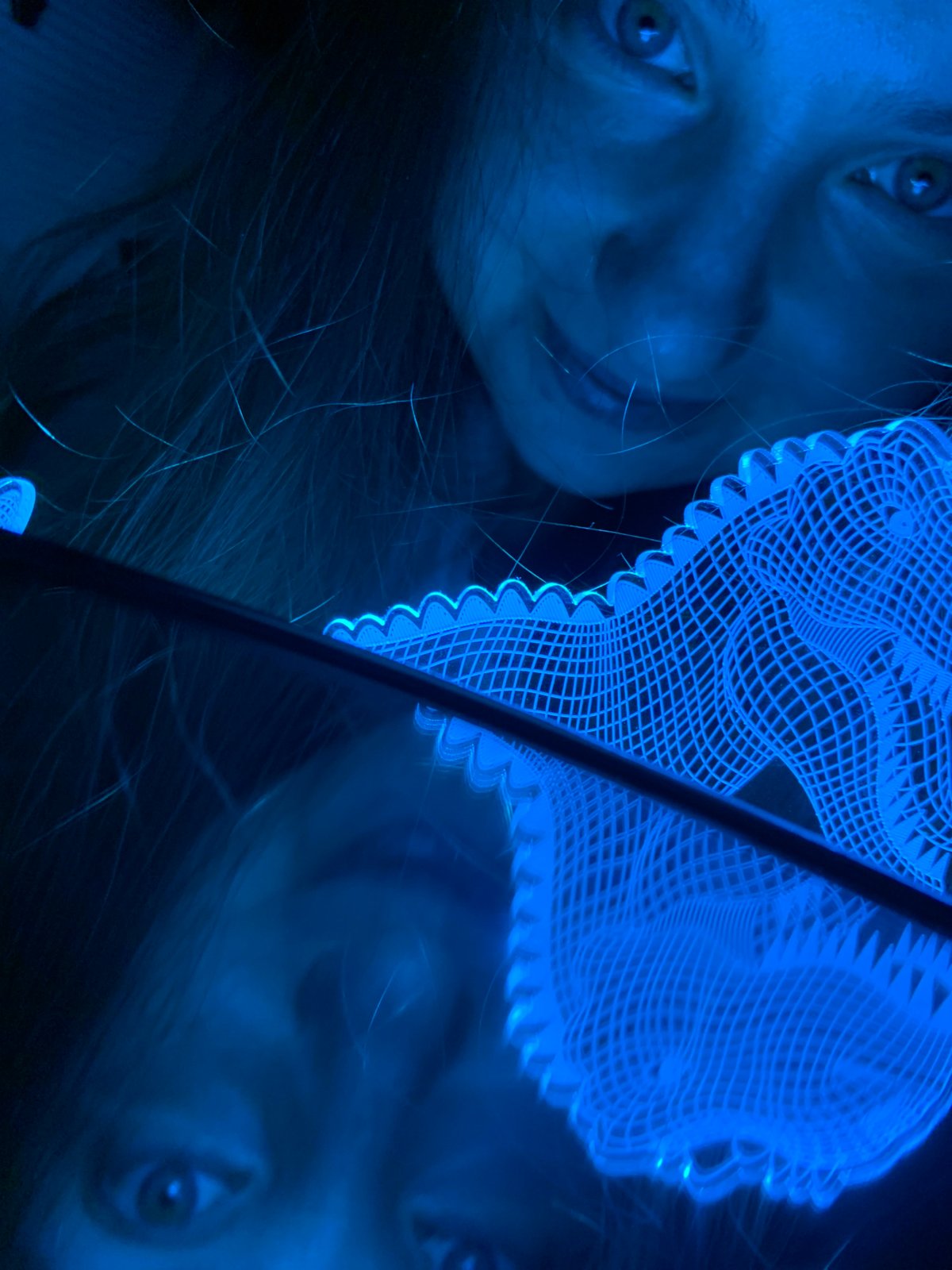 Person photographs self with color-changing dinosaur lamps in Russia