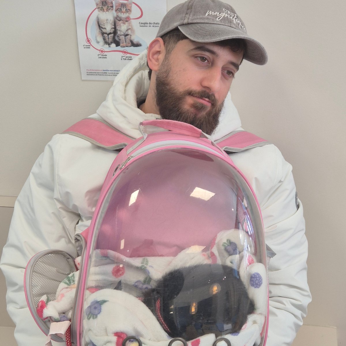 Man brings cat in bubble backpack to vet clinic