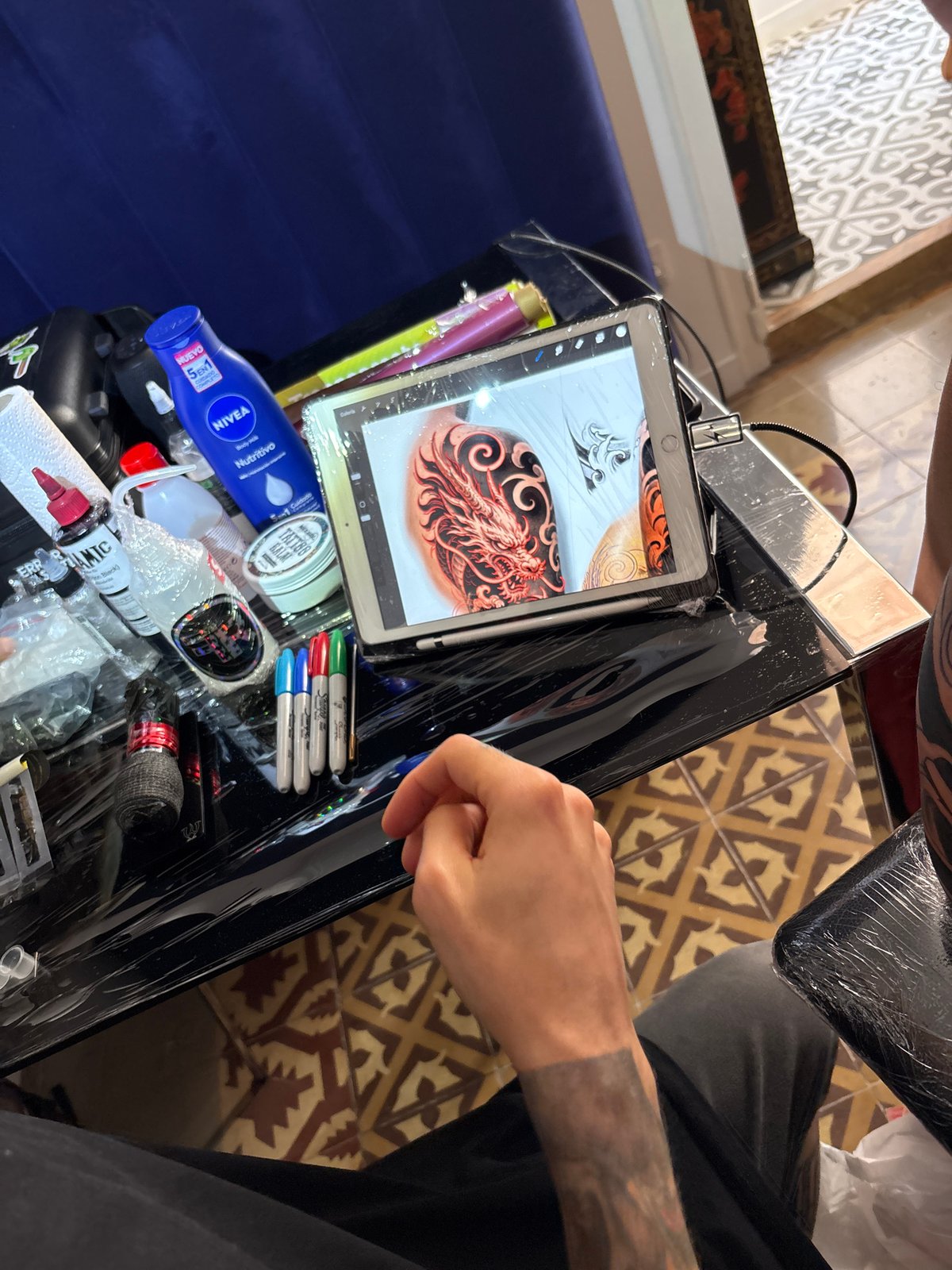 Dragon tattoo session documented in Barcelona tattoo studio