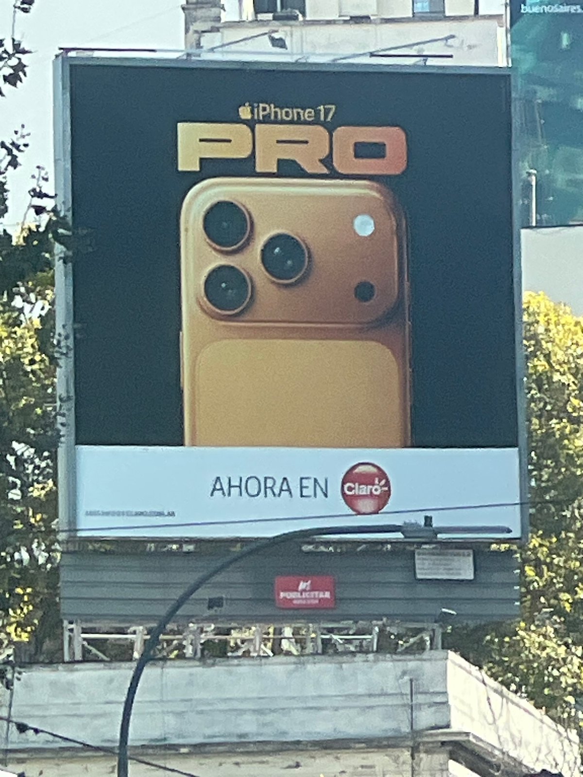 Buenos Aires street scenes: iPhone billboard, car maintenance, delivery driver