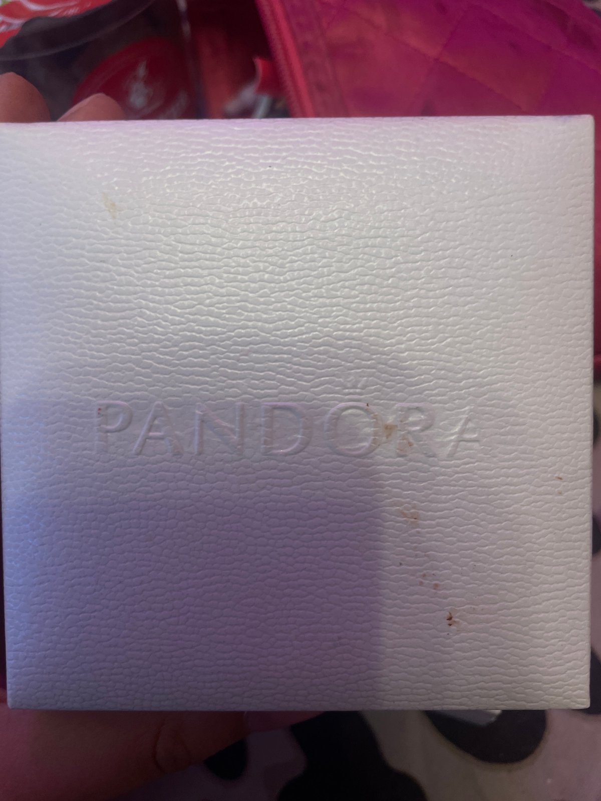 Pandora jewelry boxes photographed on bedside table in Russia