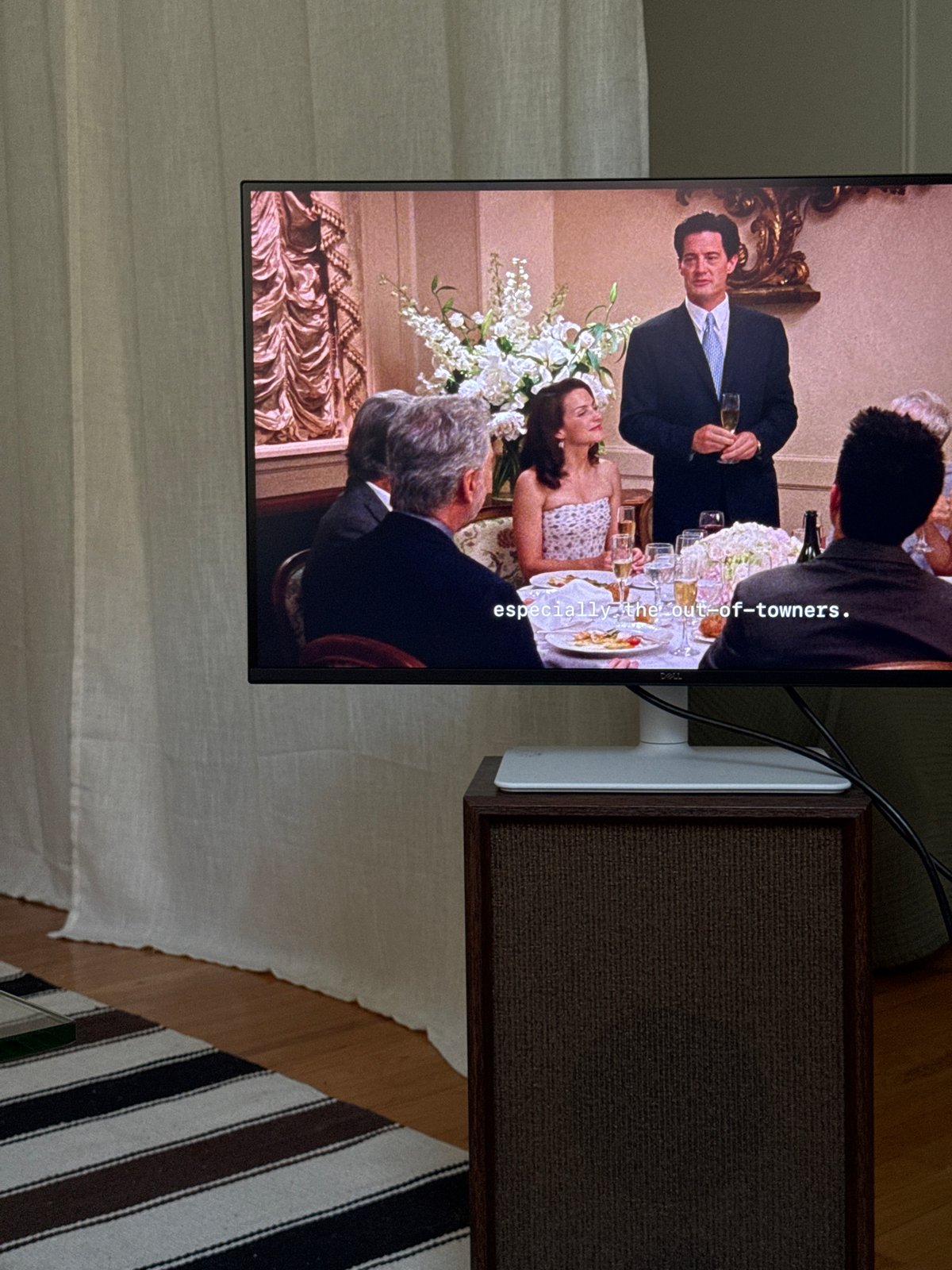 Montreal resident watches formal TV event during casual evening