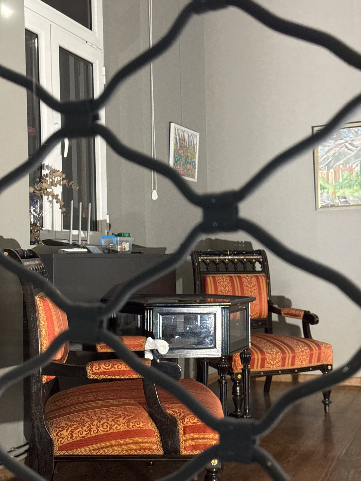 Interior glimpse through barred window in Sofia Bulgaria