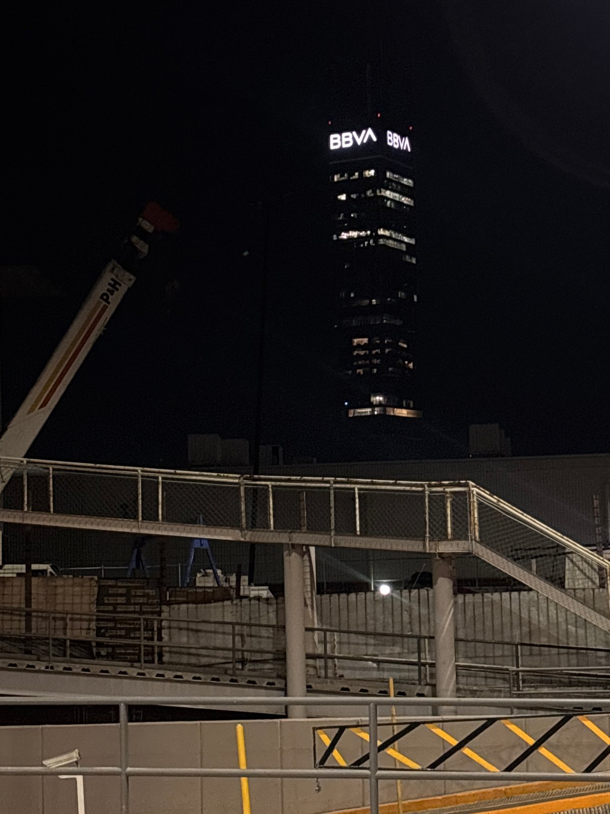 BBVA building illuminated during nighttime construction in Mexico